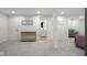 Finished basement showing neutral carpet, stylish furnishings, and bathroom at 3781 S Station Dr, Columbus, IN 47203