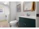 Charming half-bathroom with stylish vanity, modern fixtures, and laundry in view at 3781 S Station Dr, Columbus, IN 47203