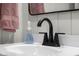 Modern bathroom features a white vanity and black faucet with stylish decor at 3781 S Station Dr, Columbus, IN 47203