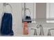 Modern bathroom vanity with sleek faucet, soap dispenser, mirror and blue towel at 3781 S Station Dr, Columbus, IN 47203