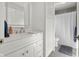 All-white bathroom featuring a single sink vanity and shower with curtain at 3781 S Station Dr, Columbus, IN 47203