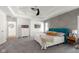 Bright bedroom featuring a tray ceiling with ceiling fan and a decorative accent wall at 3781 S Station Dr, Columbus, IN 47203