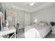 Bedroom features a tray ceiling with fan and desk at 3781 S Station Dr, Columbus, IN 47203