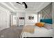 Bright bedroom featuring a tray ceiling with ceiling fan and a decorative accent wall at 3781 S Station Dr, Columbus, IN 47203