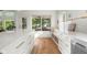 Kitchen island with storage and light-filled breakfast nook with backyard views at 3781 S Station Dr, Columbus, IN 47203