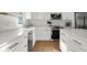New kitchen featuring white cabinets, quartz countertops, and stainless steel appliances at 3781 S Station Dr, Columbus, IN 47203
