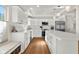 Bright, updated kitchen with white cabinets, stainless appliances, and an eat-in island at 3781 S Station Dr, Columbus, IN 47203