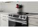 The kitchen features stainless steel appliances, white subway tile, and quartz countertops at 3781 S Station Dr, Columbus, IN 47203