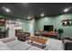 Finished basement featuring painted walls, drop ceiling and comfortable furniture at 3781 S Station Dr, Columbus, IN 47203