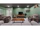 Finished basement living room featuring painted walls, drop ceiling and comfortable furniture at 3781 S Station Dr, Columbus, IN 47203