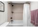 Shower featuring mosaic tile, black shower head, and glass shelves plus towel at 3781 S Station Dr, Columbus, IN 47203