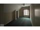 Bedroom with neutral walls, green carpeting, ceiling fan, and natural light from windows at 3917 Knoll Wood Ln, Anderson, IN 46011