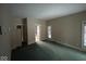 Bedroom featuring ample natural light, spacious closet, and neutral paint at 3917 Knoll Wood Ln, Anderson, IN 46011