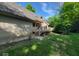 Charming home exterior showcasing a brick facade, and beautiful outdoor greenery at 3917 Knoll Wood Ln, Anderson, IN 46011