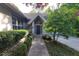 A beautiful walkway leads to a well-maintained light brick home and covered entryway at 3917 Knoll Wood Ln, Anderson, IN 46011