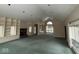Spacious living room with fireplace, built-ins, and large windows for natural light at 3917 Knoll Wood Ln, Anderson, IN 46011