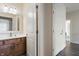 Bathroom with a vanity with wood cabinets and a view into the hallway at 4139 Bayberry Ct, Greenwood, IN 46143