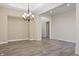 Dining area featuring modern lighting, neutral walls, hardwood floors, and large opening at 4139 Bayberry Ct, Greenwood, IN 46143