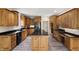A spacious kitchen featuring custom wood cabinetry, granite countertops, and stainless steel appliances at 4139 Bayberry Ct, Greenwood, IN 46143