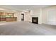Living room featuring a fireplace and open bar area at 4139 Bayberry Ct, Greenwood, IN 46143