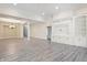 Large living space with hardwood floors, built-in shelving, and recessed lighting at 4139 Bayberry Ct, Greenwood, IN 46143