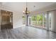A light-filled room with hardwood floors, glass doors leading to the exterior, and neutral paint at 4139 Bayberry Ct, Greenwood, IN 46143