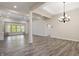 Spacious living room with tray ceilings, hard wood floors, neutral walls, and large window at 4139 Bayberry Ct, Greenwood, IN 46143