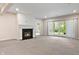 Living room featuring a fireplace and glass doors to the backyard at 4139 Bayberry Ct, Greenwood, IN 46143