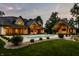 Beautiful backyard with a large in-ground pool, stone patio, and an outdoor fireplace at 4242 Watson Rd, Greenwood, IN 46143