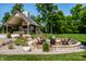 Expansive backyard featuring a fire pit area and outdoor living space, blending seamlessly with the lush landscape at 4242 Watson Rd, Greenwood, IN 46143
