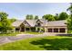 Stunning single Gathering home with a three car garage, manicured lawn, and inviting curb appeal at 4242 Watson Rd, Greenwood, IN 46143