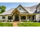 Charming home exterior highlighting the welcoming front door, stone facade, and manicured landscaping at 4242 Watson Rd, Greenwood, IN 46143