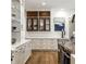 Elegant kitchen featuring white cabinets, granite counters, and seamless access to living spaces at 4242 Watson Rd, Greenwood, IN 46143