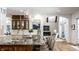 Gourmet kitchen with granite island, pendant lighting, and seamless transition to living area at 4242 Watson Rd, Greenwood, IN 46143