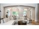 Open-concept living room with hardwood floors, neutral color palette, and seamless flow to other areas at 4242 Watson Rd, Greenwood, IN 46143