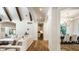 Bright and airy living space showing hardwood flooring flowing into dining area at 4242 Watson Rd, Greenwood, IN 46143