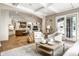 Open concept living area with hardwood floors, a beamed kitchen island, and a light and airy feel at 4242 Watson Rd, Greenwood, IN 46143