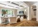 Bright living room features coffered ceiling, large window with backyard views, and hardwood floors at 4242 Watson Rd, Greenwood, IN 46143