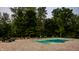 Luxurious pool area with lounge chairs and a nearby fire pit, perfect for outdoor relaxation and entertaining at 4242 Watson Rd, Greenwood, IN 46143