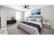Bedroom boasts neutral walls, carpet, and a ceiling fan above a beautifully made bed at 4316 London Ct, Anderson, IN 46013