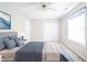 This bedroom features neutral walls, carpet, and a ceiling fan above a beautifully made bed at 4316 London Ct, Anderson, IN 46013