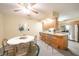 Bright dining room with modern decor, sleek chairs, ceiling fan, and view into the kitchen at 4316 London Ct, Anderson, IN 46013