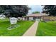 Charming clubhouse with well-maintained landscaping, walkway, and inviting double-door entrance at 4316 London Ct, Anderson, IN 46013