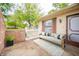 Inviting front porch with stylish seating, greenery, and an eye-catching rug at 4316 London Ct, Anderson, IN 46013