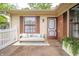 Inviting front porch with stylish seating, a new door, and decorative touches at 4316 London Ct, Anderson, IN 46013