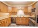 A kitchen with wood cabinets, stainless steel appliances, and plenty of counter space at 4316 London Ct, Anderson, IN 46013