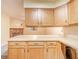 A countertop overlooks the living area, providing a view of the fireplace and living space at 4316 London Ct, Anderson, IN 46013