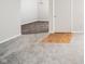 Neutral living room with plush carpet, doorway to other rooms, and blank canvas at 4316 London Ct, Anderson, IN 46013