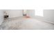 Bright and airy living room with plush carpet, a lamp, and view to other rooms at 4316 London Ct, Anderson, IN 46013