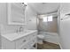 This bathroom features new paint, new floors, shower, and a new sink and faucet at 4457 Campbell Ave, Indianapolis, IN 46226